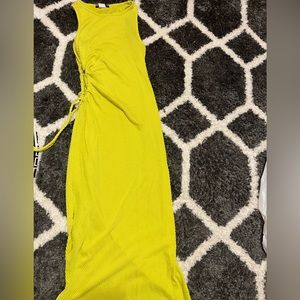 A neon fitted dress with side slit and split.